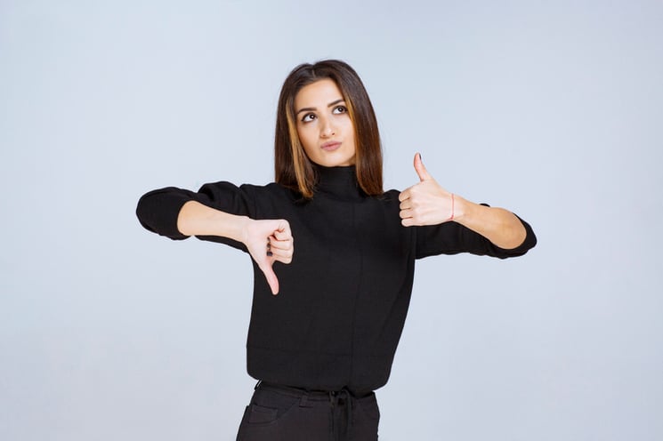 girl-showing-thumb-up-and-down-sign-high-quality-photo-1