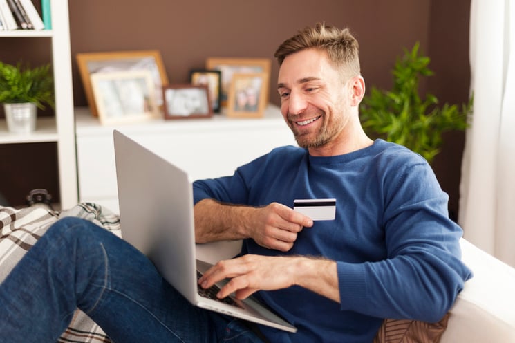 smiling-man-during-online-shopping-at-home-1